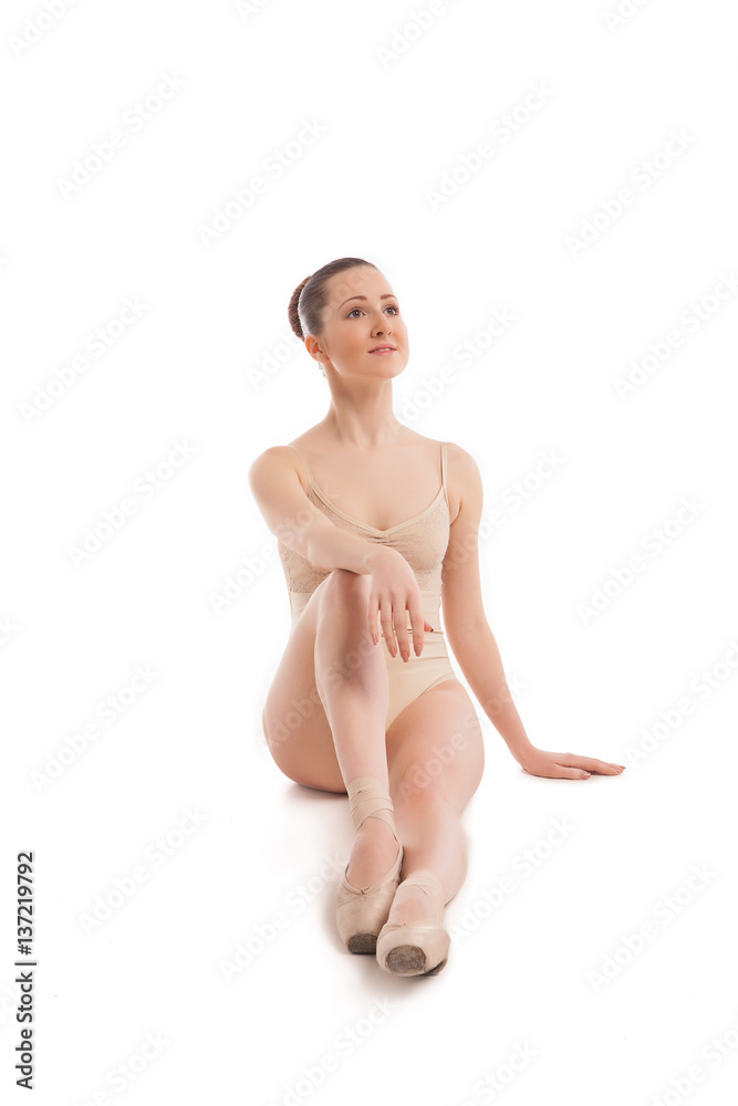 young pretty ballet dancer sitting in elegant pose young pretty ballet dancer sitting in elegant pose