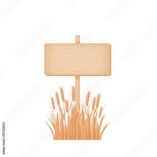 Wooden rectangular signboard on a pole at the wheat field
