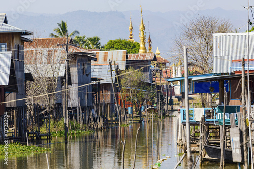 Traditional wooden stilt houses at the Inle lake photo