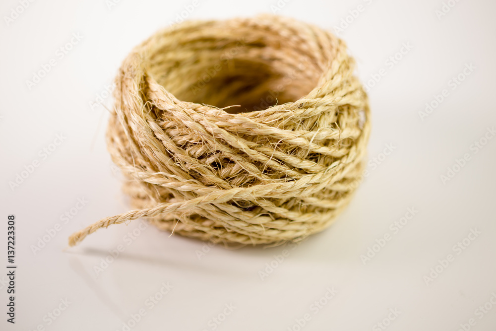 Ball of twine on white background