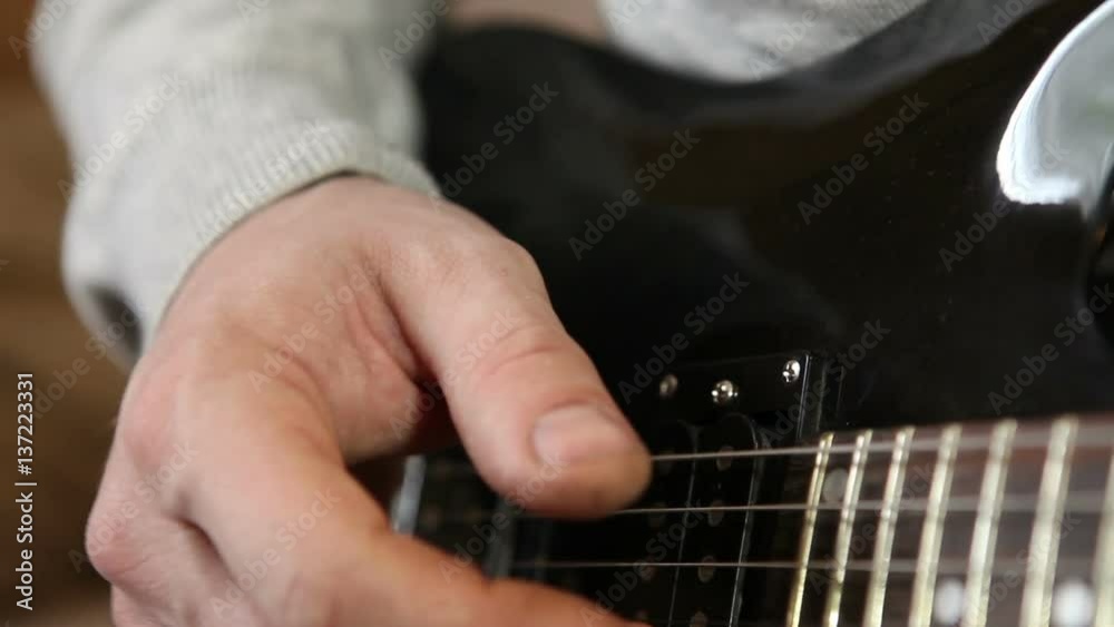 hand man playing guitar close up hand man playing guitar close up