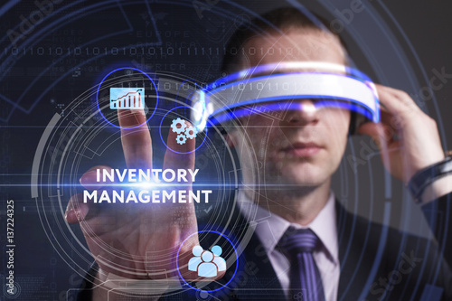Business, Technology, Internet and network concept. Young businessman working in virtual reality glasses sees the inscription: Inventory management