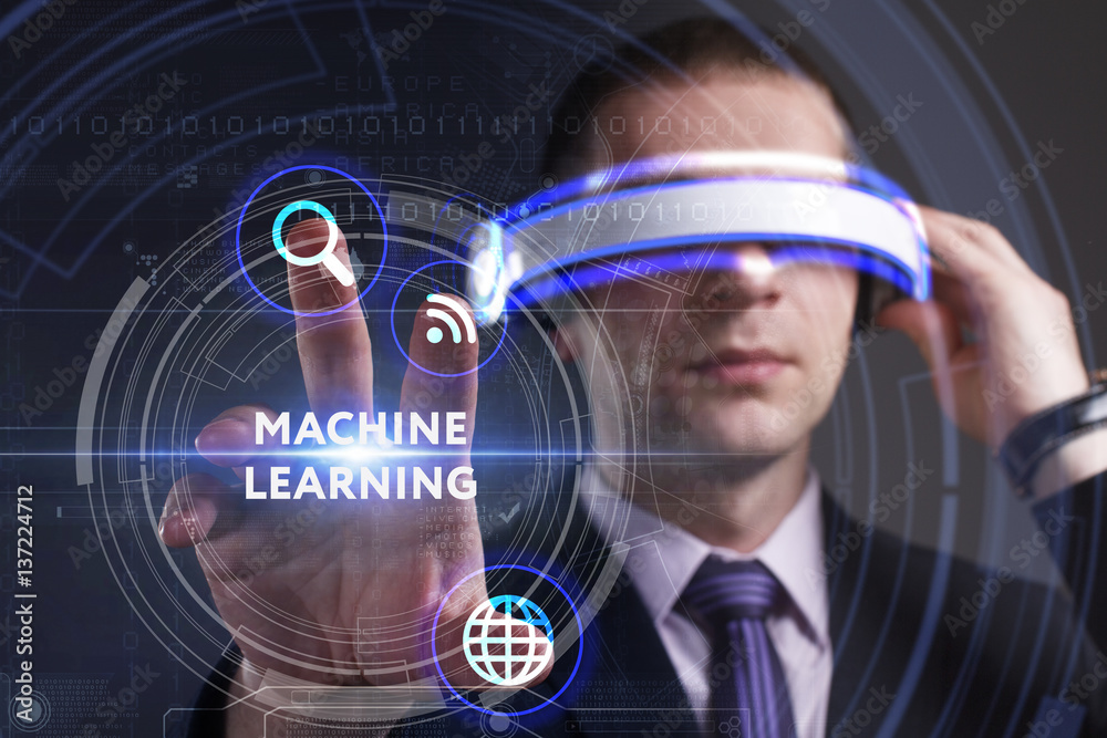 Business, Technology, Internet and network concept. Young businessman working in virtual reality glasses sees the inscription: Machine learning Business, Technology, Internet and network concept. Young businessman working in virtual reality glasses sees the inscription: Machine learning