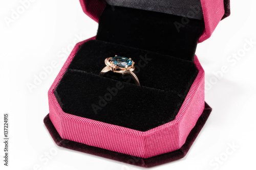 Gold ring with blue Topaz in a velvet gift box © berkut_34