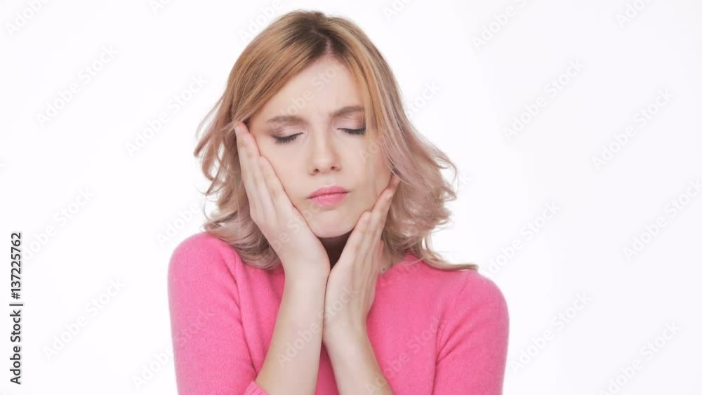 Woman in pink sweater with severe toothache Woman in pink sweater with severe toothache