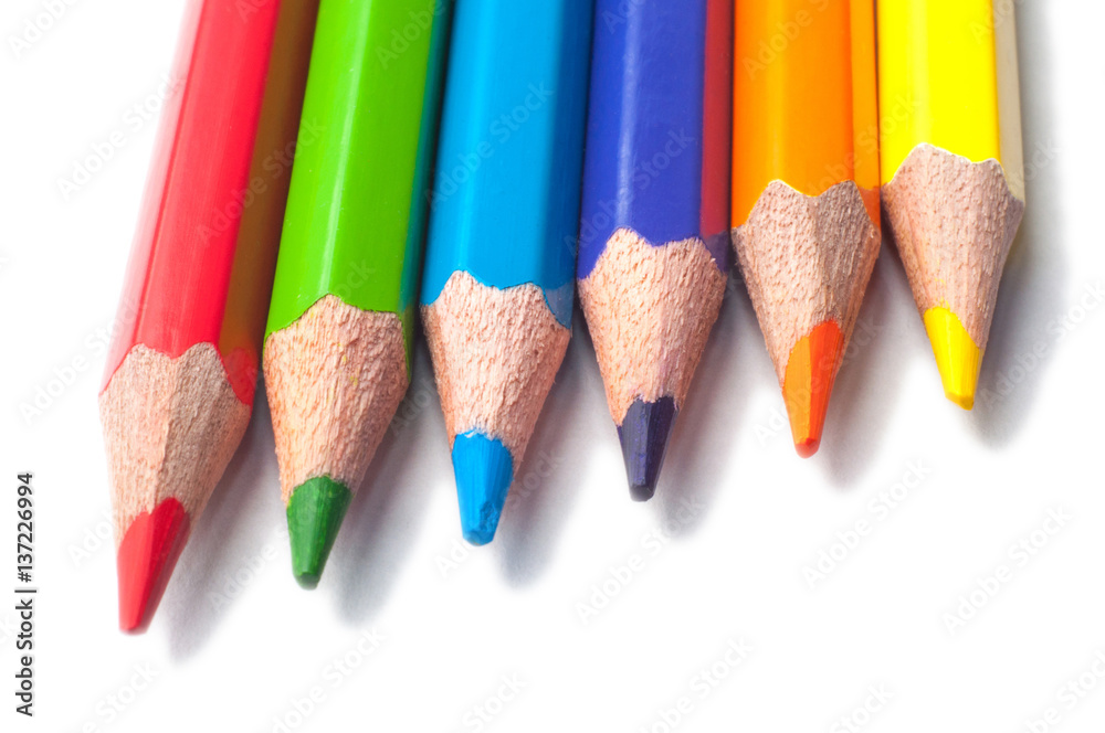 Colored pencils isolated on a white background macro Colored pencils isolated on a white background macro