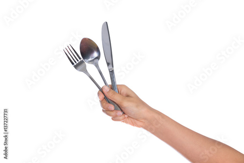 knife, Fork and spoon held by a woman's hands isolated