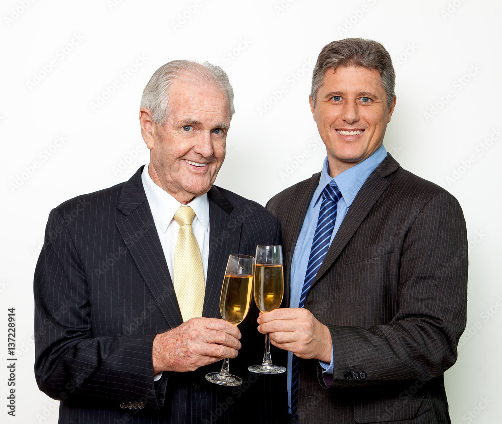 Successful men drinking champagne at office party Successful men drinking champagne at office party