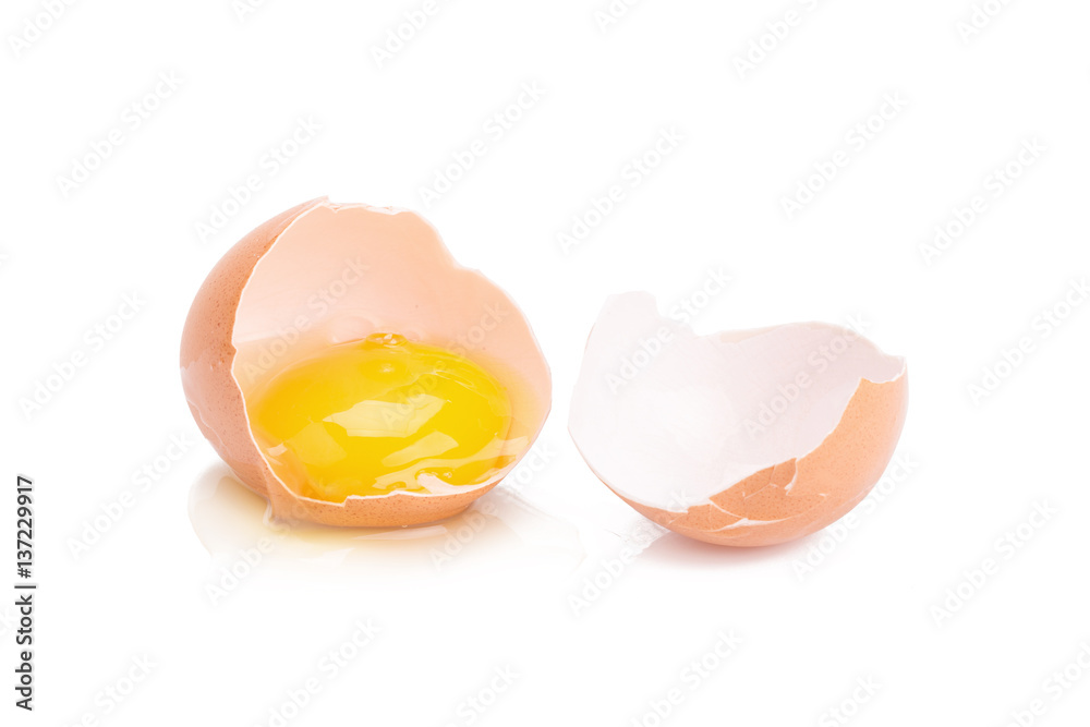 Close up of cracked egg on white background. Close up of cracked egg on white background.
