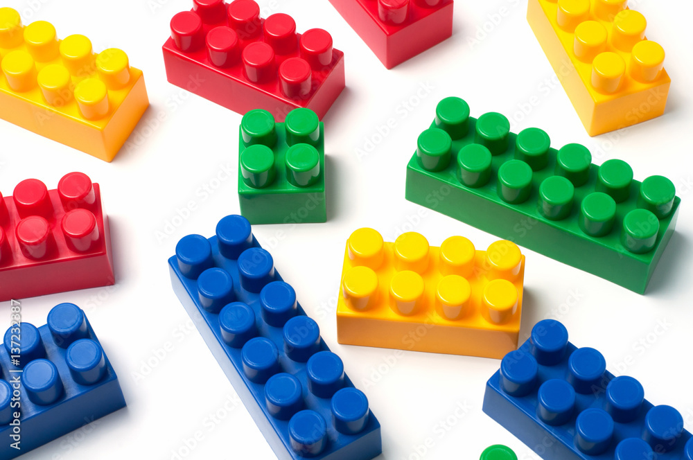 Fotografie Building blocks - plastic construction toy isolated on white background