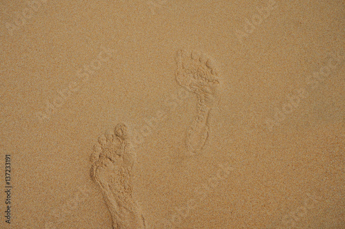 beach, wave and footsteps at sunset time