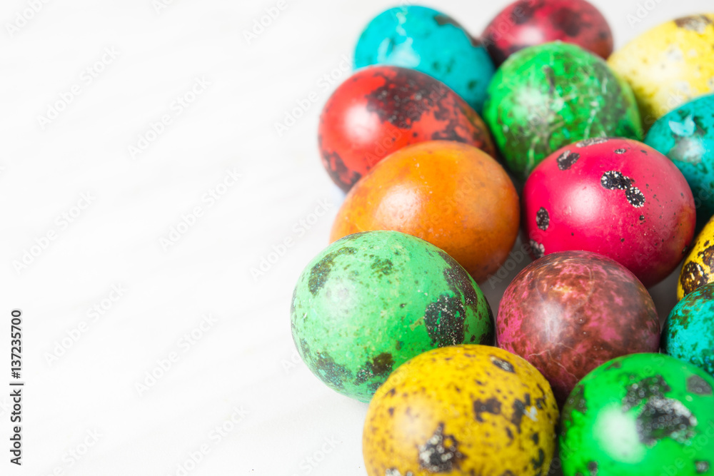 Color quail eggs on the white background Color quail eggs on the white background
