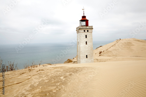 Rubjerk Knude lighthouse amongst coastal sand dunes, Denmark