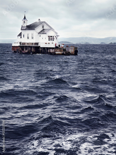 Traditional whitewashed church on island in Oslofjord, Oslo, Norway