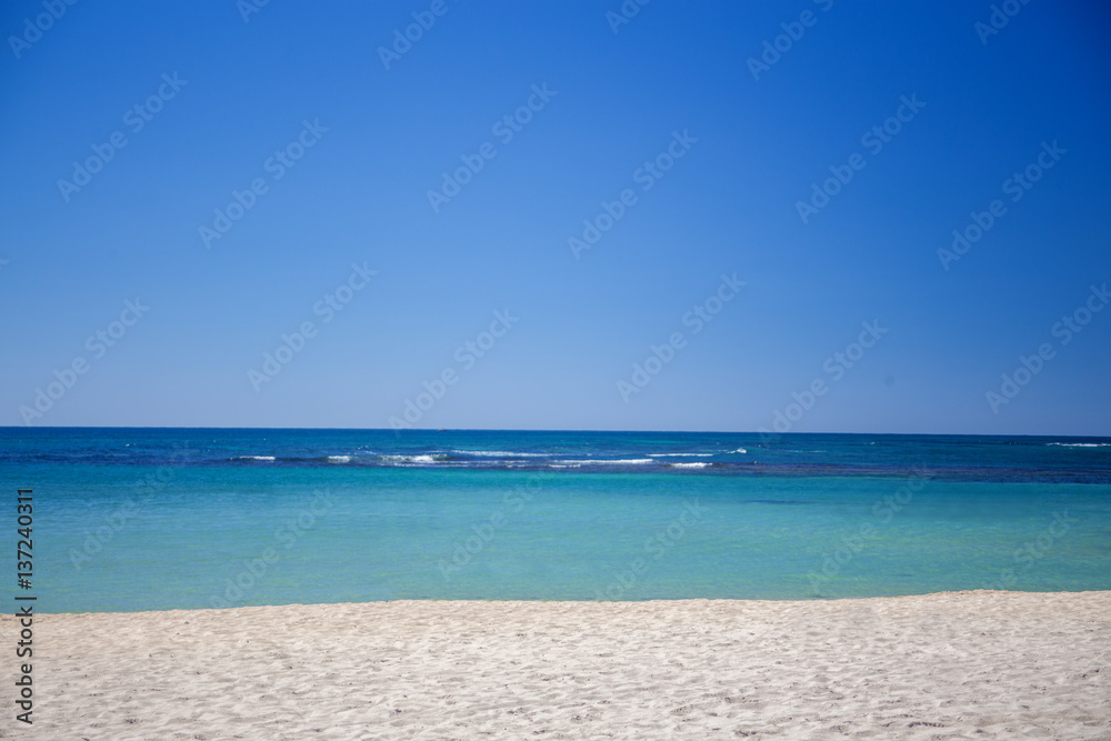 Sandy Beach on the Caribbean sea. Clear water, sand and blue sky Sandy Beach on the Caribbean sea. Clear water, sand and blue sky