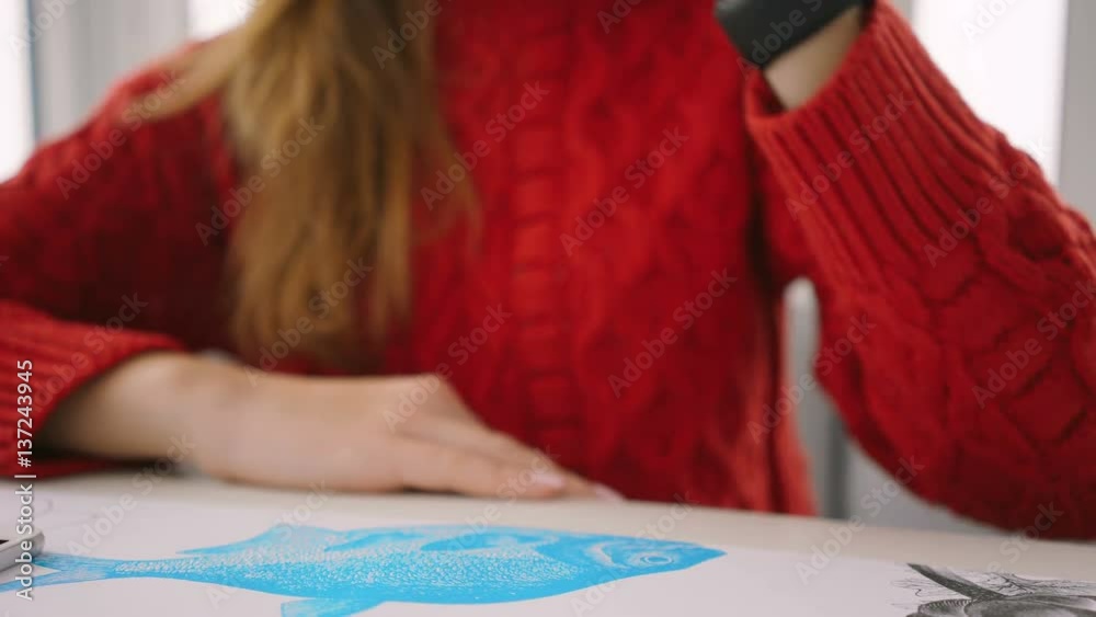 Cropped view of Woman in red sweater using wristwatch and drinking coffee. Focus on wristwatch Cropped view of Woman in red sweater using wristwatch and drinking coffee. Focus on wristwatch