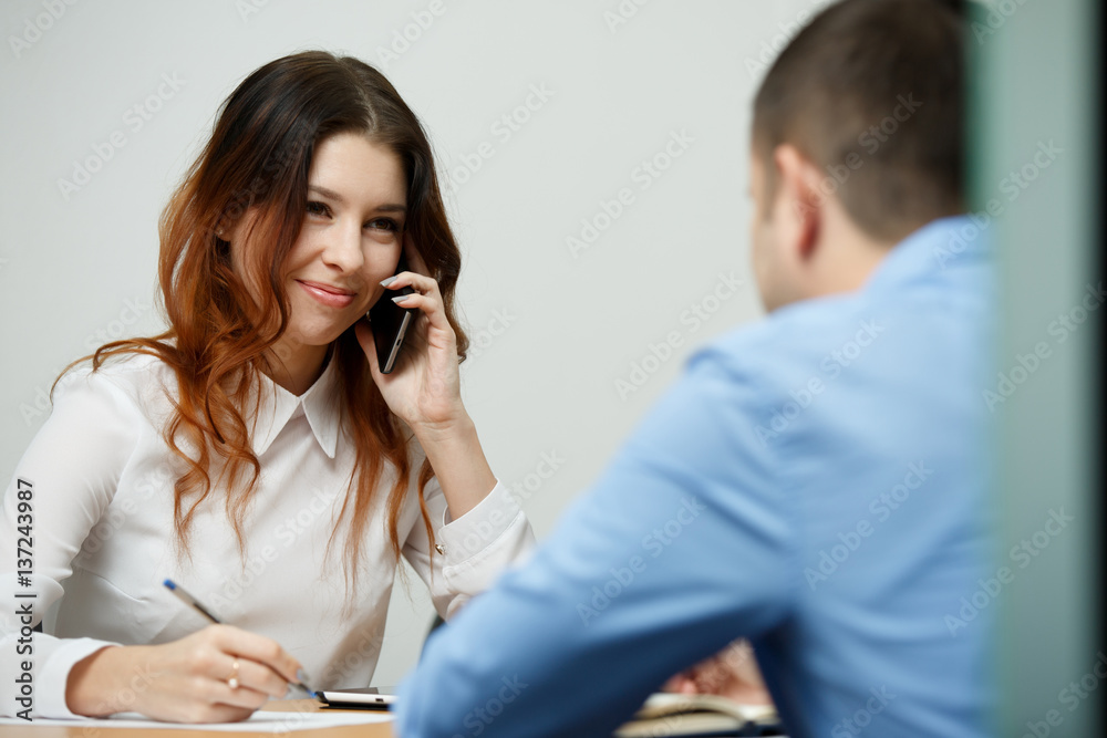 Young brunette talking on phone Young brunette talking on phone