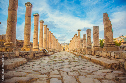 Ancient Roman ruins, walkway along the columns in Jerash, Jordan photo