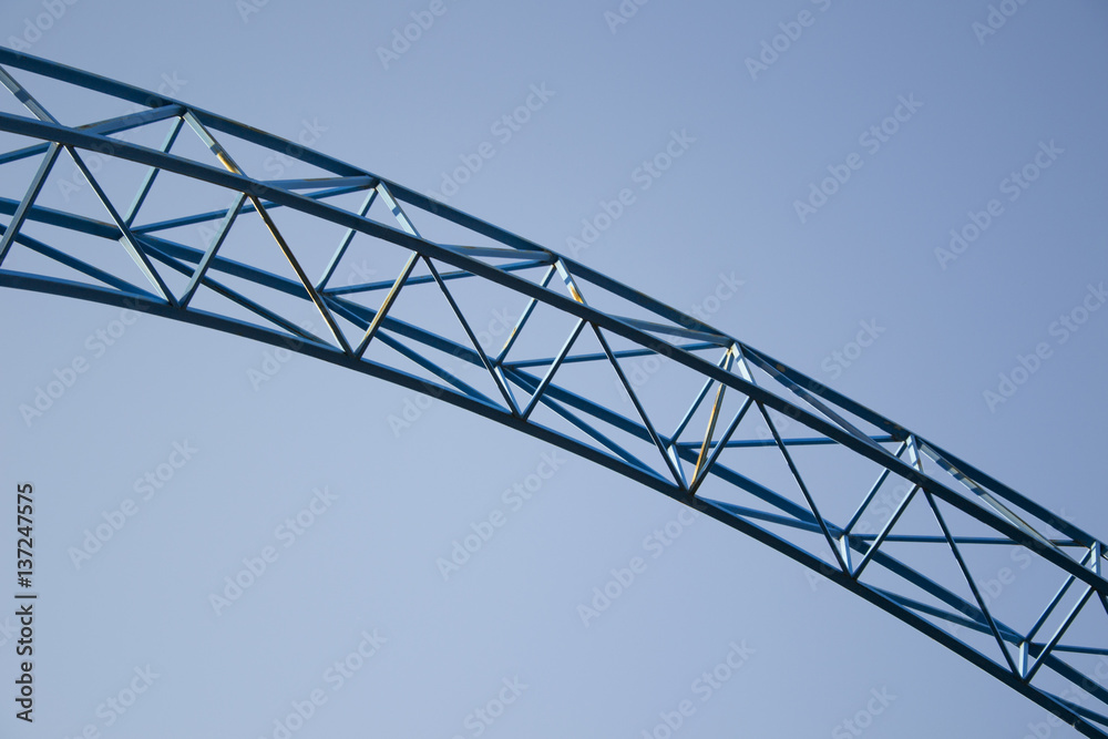 Metallic construction on the blue sky background