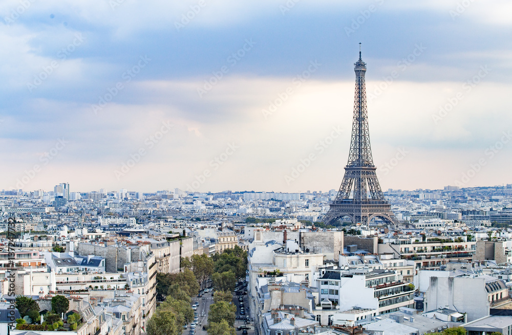 Evening Eiffel tower and Paris city view form Triumph Arc. Eiffel Tower from Champ de Mars, Paris, France. Beautiful Romantic background.