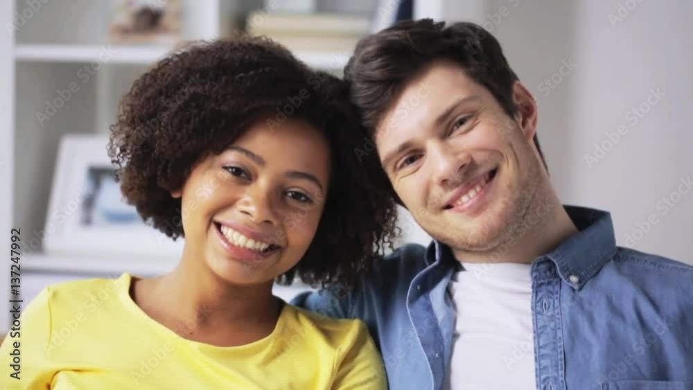 happy smiling international couple at home happy smiling international couple at home