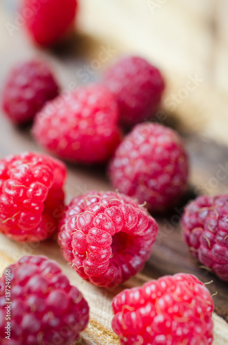 Fresh Organic Raspberry on Rustic Background.