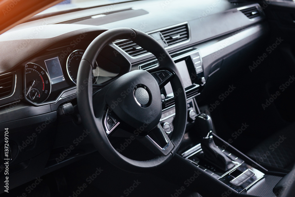 Modern car interior dashboard and steering wheel