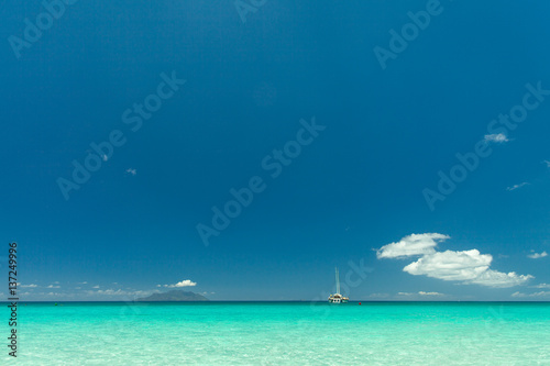Seychelles. Transparent turquoise water and blue sky on the background. © Pavel Korotkov