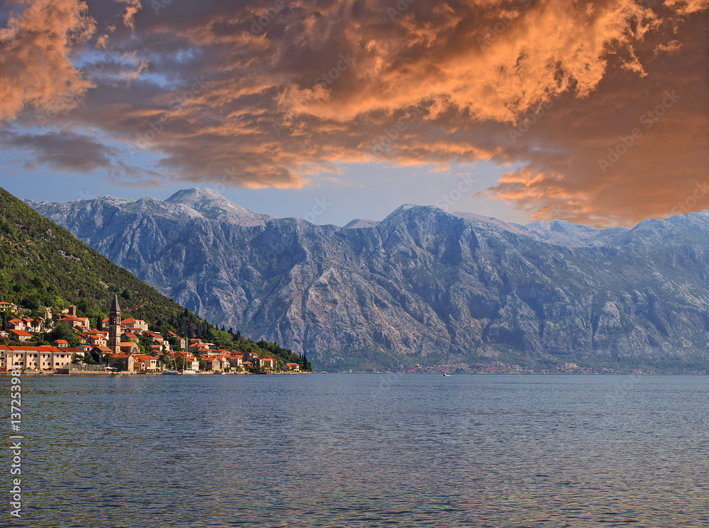 View of Perast and Kotor Bay, Montenegro. The old european city and mountain under the dramatic sky