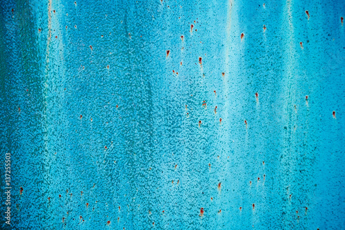 Cracked painted old metal texture. Blue color. Rusted surface