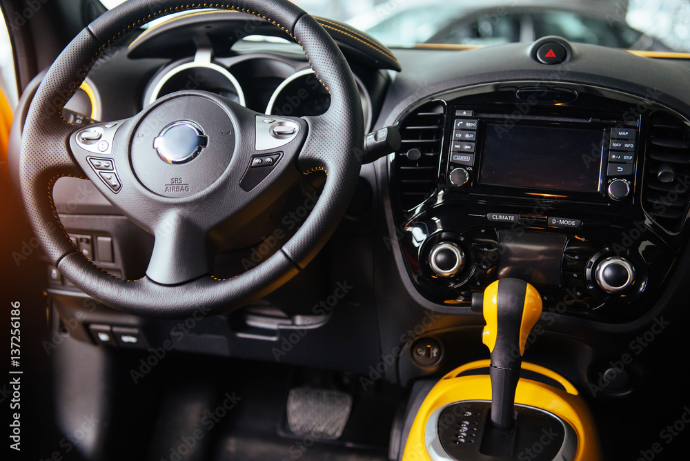 Modern car interior dashboard and steering wheel Modern car interior dashboard and steering wheel