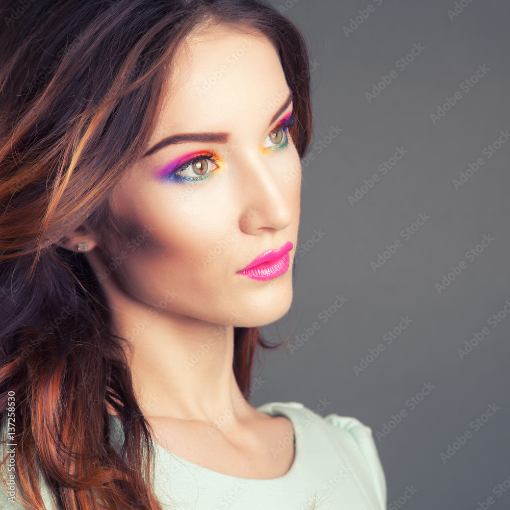 Naklejka premium Beautiful young woman with vivid makeup