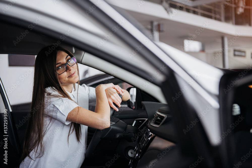 portrait of young beautiful woman sitting in the car portrait of young beautiful woman sitting in the car