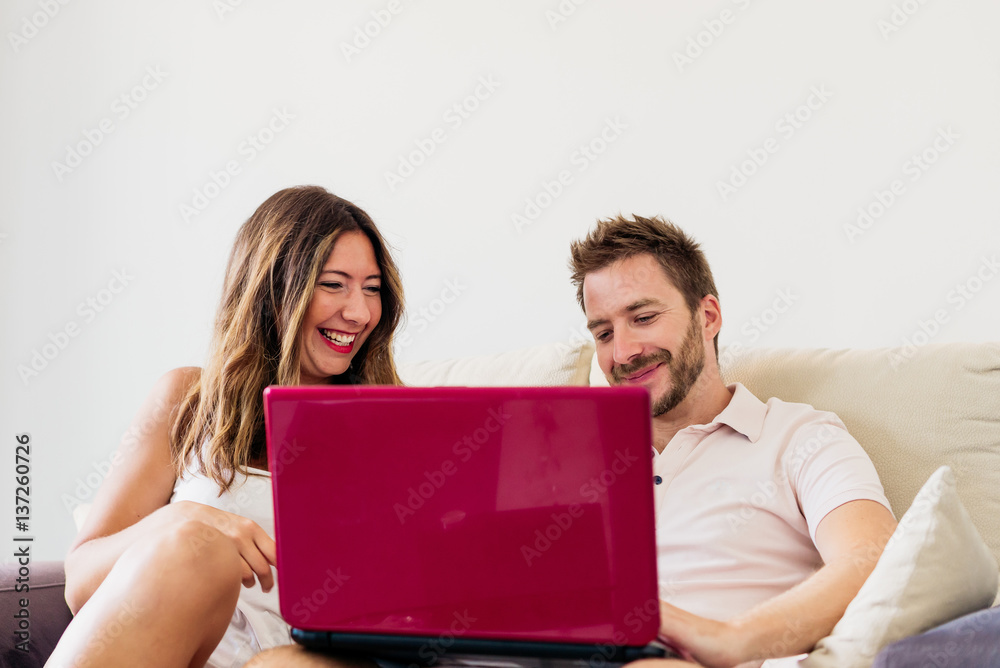 A couple surfing the laptop