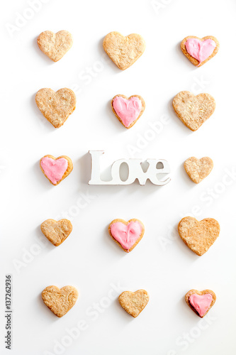 cookies for Valentine Day heartshaped white background top view pattern
