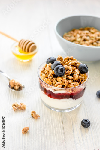 Healthy morning with granola breakfast on white kitchen table