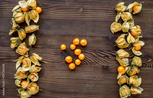 physalis on wooden background top view mock up