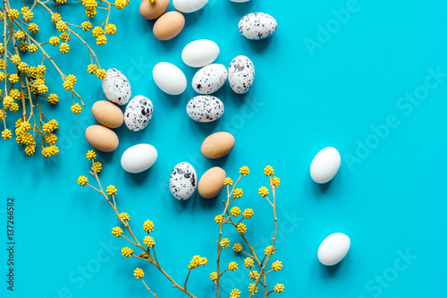 Bright easter set with eggs on blue background top view mock-up