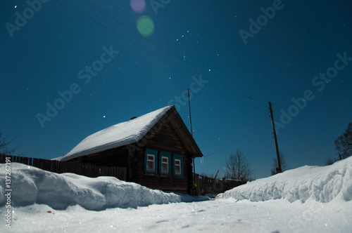 Old house in the moonlight in the snow © dmitriydanilov62