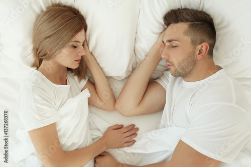 Young cute couple sleeping ...