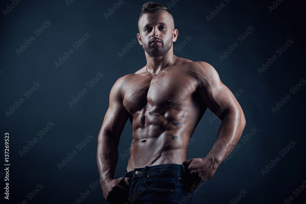 Handsome attractive sexy muscular young adult male fitness model portrait