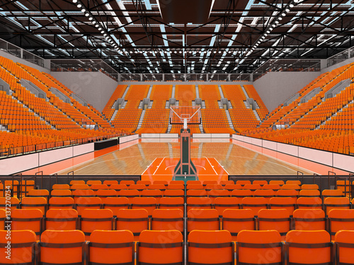 Beautiful sports arena for basketball with orange seats and VIP boxes photo