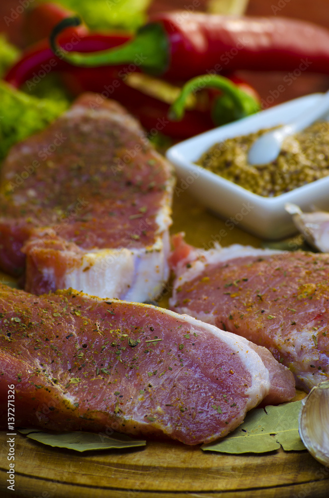 raw meat steaks with spices