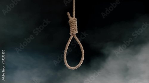 Hang mans noose swinging above fog from smoke machine studio shot at 120 fps
