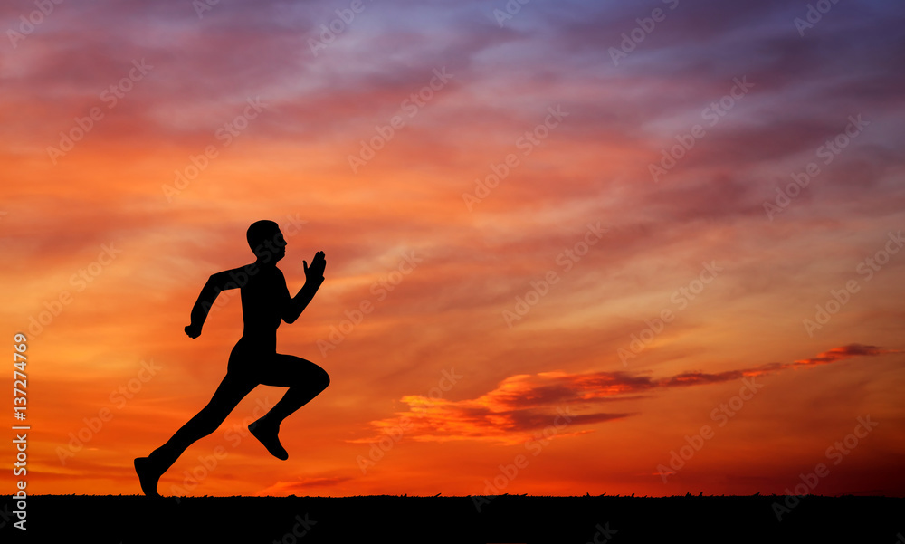 Silhouette of running man on sunset fiery sky background Silhouette of running man on sunset fiery sky background