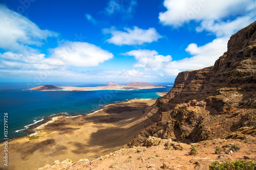 Panorama of the island of La Graciosa, northern of lanzarote, seen from Mirador de Guinate. Canary Islands, Spain. photo