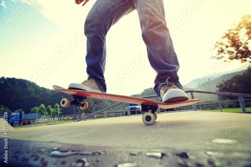 people legs practice skateboarding at skatepark © lzf