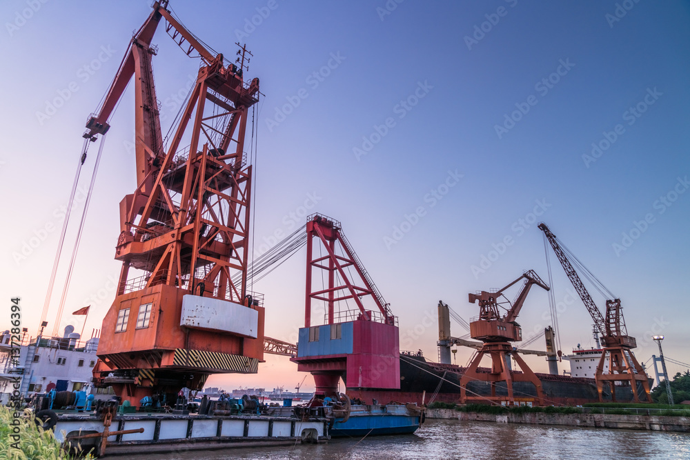 Cargo container ship at harbor in city of China.