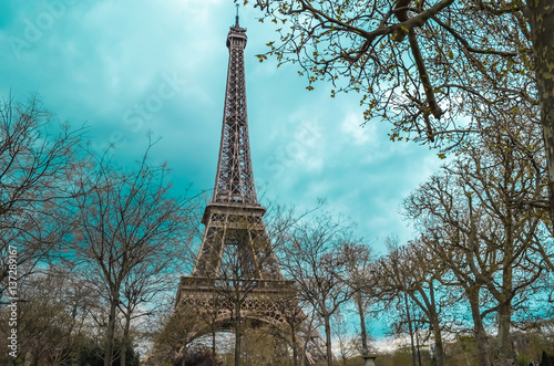 View The Eiffel Tower middle section, the city in the background in Paris, France. Vintage, retro style . Paris Best Destinations in Europe © Nitiphonphat