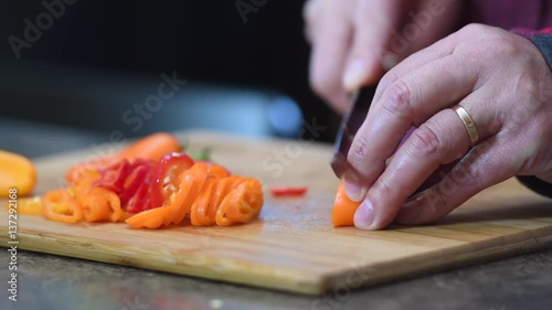 Man Cutting Peppers